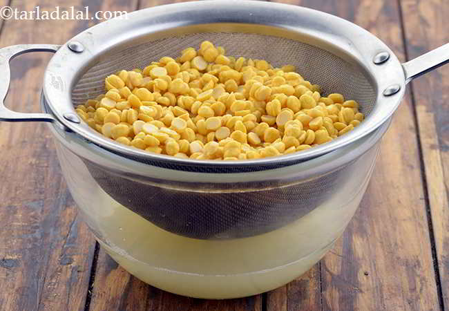Step 2 – Drain the chana dal using a strainer and discard the water.