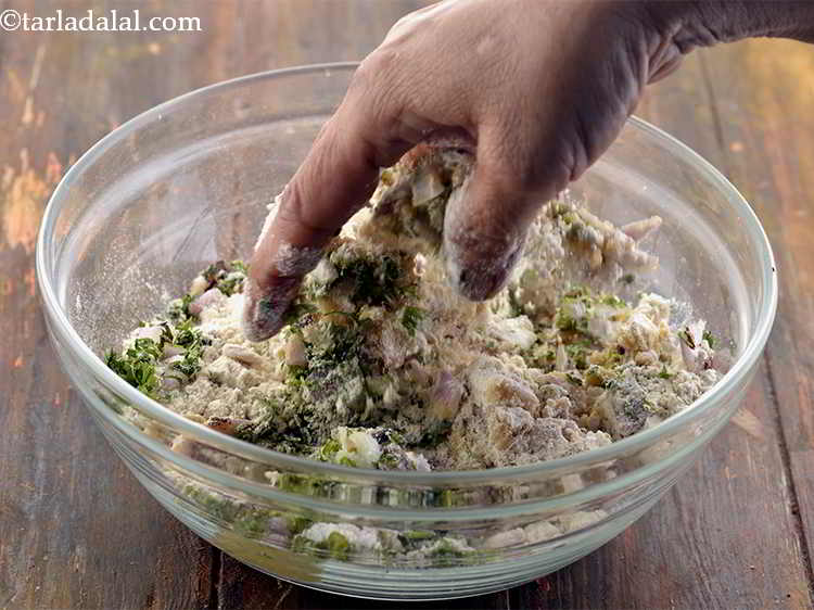 Step 13 – Mix the&nbsp;<strong>Sindhi Koki</strong>&nbsp;dough well with your hands.