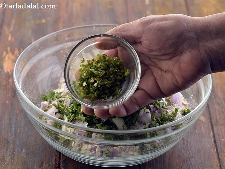 Step 8 – Now add the <a href="https://www.tarladalal.com/glossary-green-chillies-331i#ing_820" target="_blank">chopped green chillies</a> for the spice.
