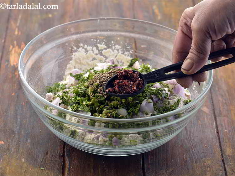 Step 10 – Now add the <a href="https://www.tarladalal.com/glossary-pomegranate-powder-1221i" target="_blank">pomegranate (anardana) powder</a> for the mild tartness.