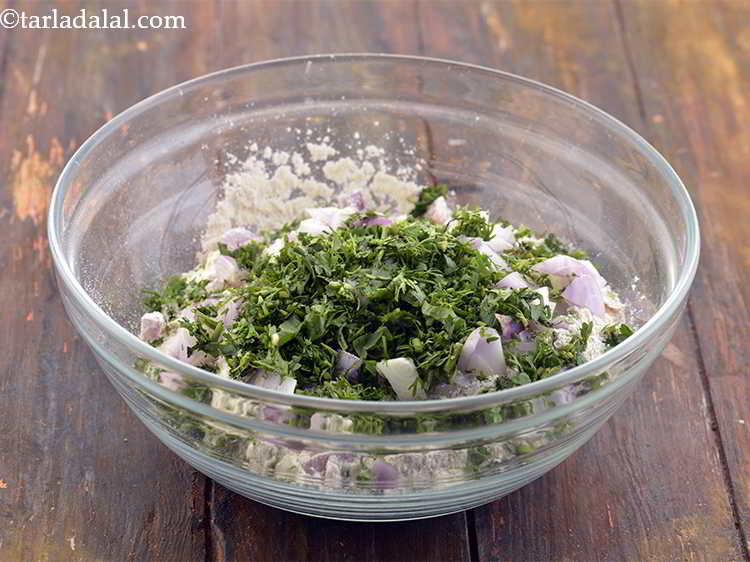 Step 7 – Add the <a href="https://www.tarladalal.com/glossary-coriander-369i#ing_783" target="_blank">chopped coriander (dhania)</a> for a hint of freshness.