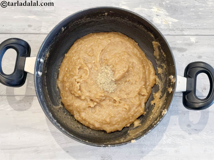 Step 11 – Switch off the flame, add the cardamom powder.