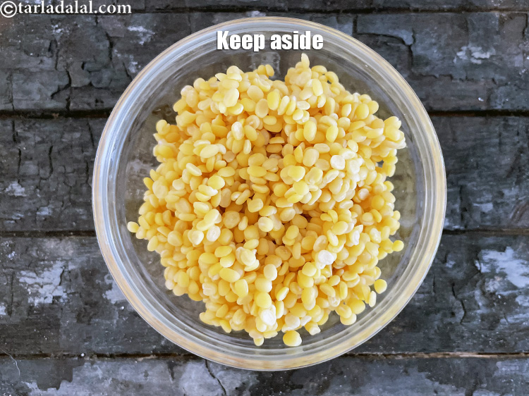 Step 11 – <meta charset="UTF-8" /> Keep aside <strong>soaked and drained yellow moong dal.</strong>