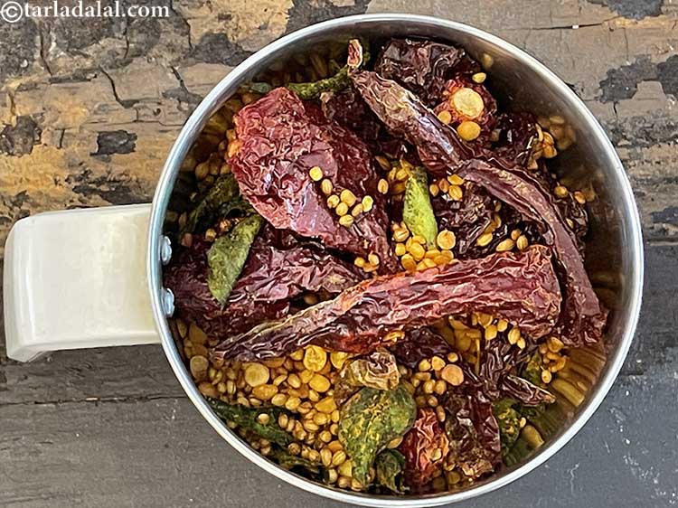 Step 29 – Keep aside to cool completely. Then put the roasted masala in a blender.