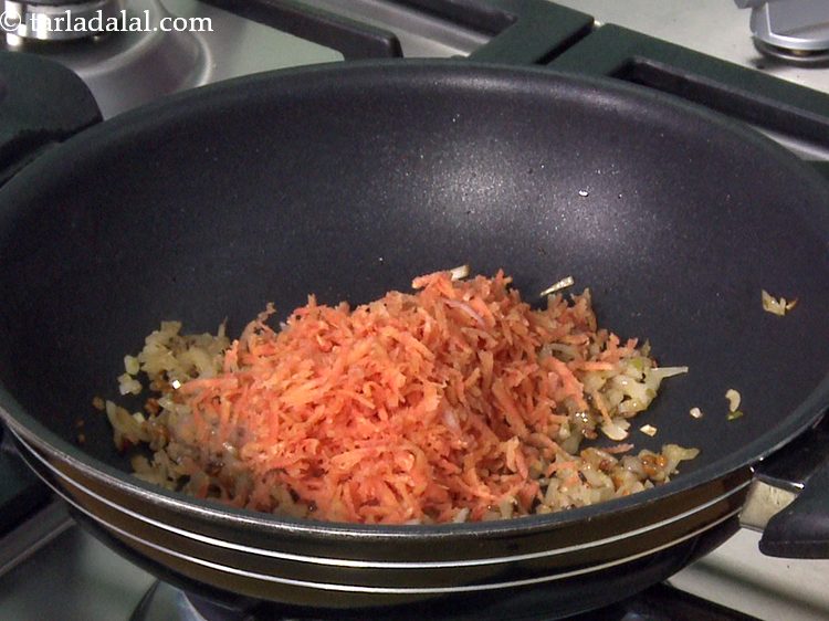 Step 16 – Add grated carrots and saut&eacute; on a medium flame for 2 to 3 minutes. Carrots …