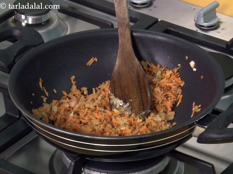 Step 17 – Saute the carrots for a while, approx. 1 to 2 minutes. <a href="https://www.tarladalal.com/article-health-benefits-of-gajar-carrots-258" target="_blank"><strong>Read other …