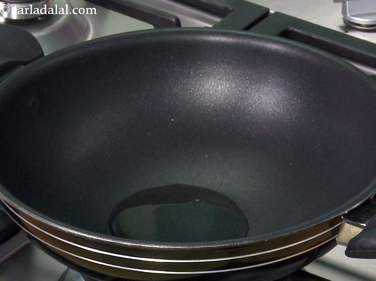 Step 9 – Heat the oil in a pan / kadhai.