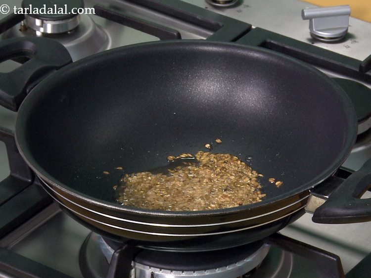 Step 12 – Saut&eacute; it on a medium flame till the dal turns light brown. Be careful that …