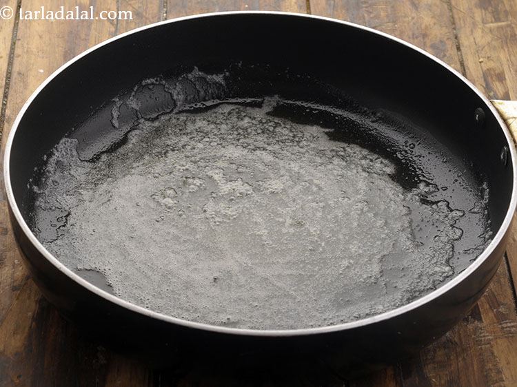 Step 17 – To prepare <strong>spaghetti balls</strong> mixture, heat the butter in a broad non-stick pan.