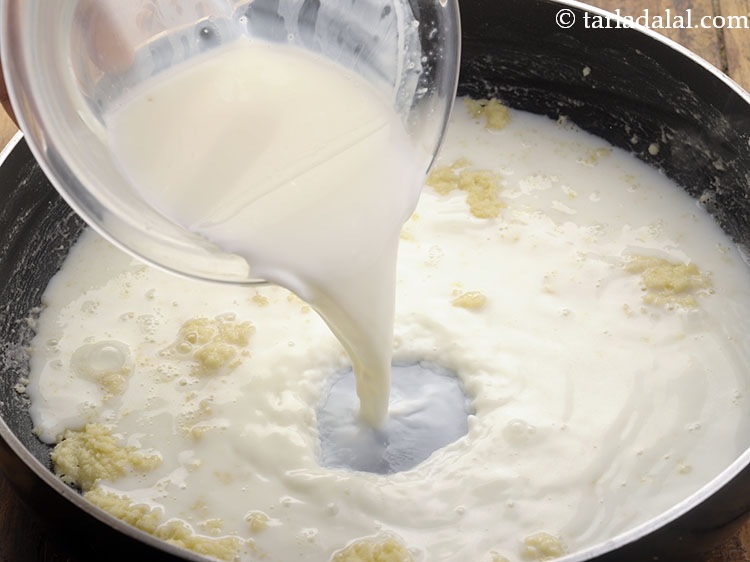 Step 20 – Add milk when the flour turns frothy.
