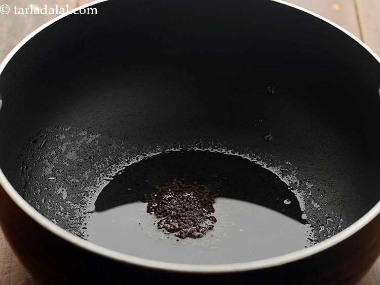 Step 2 – Once the oil is hot, add mustard seeds.