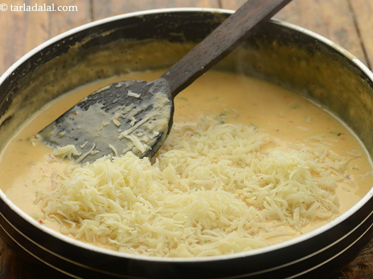 Step 16 – Switch off the flame, add the mozzarella cheese. I like to use a combination of …