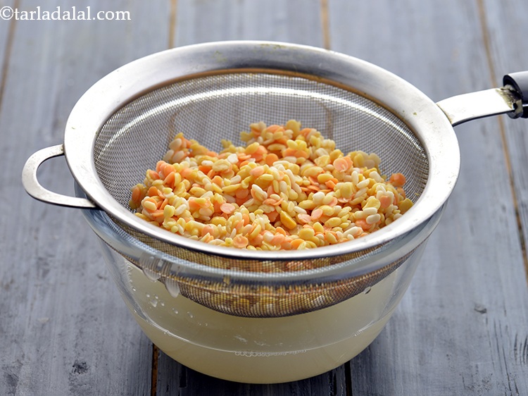 Step 7 – After an hour, drain the dals.