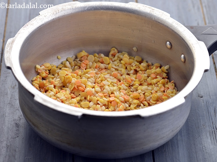 Step 8 – For cooking the <strong>spicy mixed dal</strong>, we will now pressure cook the dals so add …