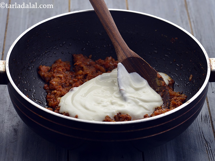 Step 26 – Add the curd. The <a href="https://www.tarladalal.com/recipes-for-High-Protein-Dals-Kadhi-697" target="_blank">protein</a> in this recipe comes from the various dals …