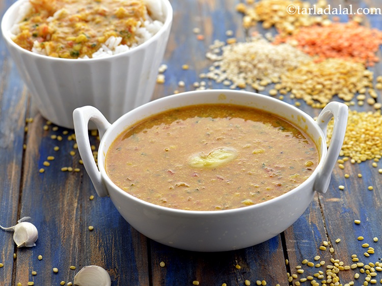 Step 31 – Serve the <strong>spicy mixed dal</strong> hot with <a href="https://www.tarladalal.com/recipes-for-Roti-Indian-Roti--Collection--199" target="_blank">rotis</a> or <a href="https://www.tarladalal.com/recipes-for-Paratha-Collection-200" target="_blank">parathas</a>. To …