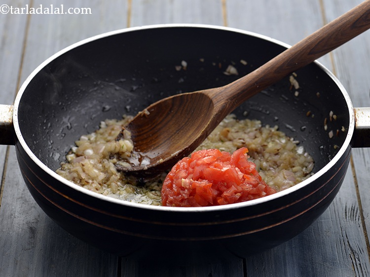 Step 19 – Add the tomatoes. Use best quality, red ripe tomatoes to get a flavorful dal.