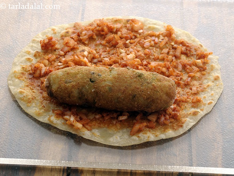 Step 43 – Place the fried potato roll over it.