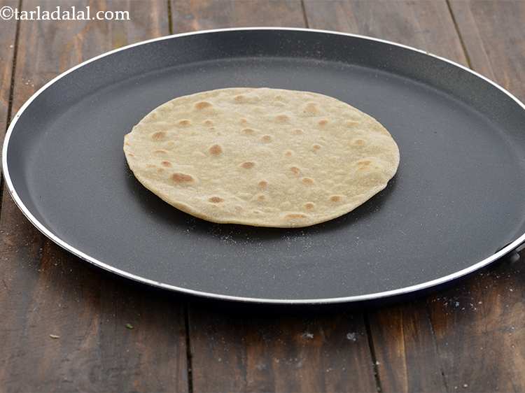 Step 13 – Cook the roti till golden brown spots appear on both the sides. If not preparing …