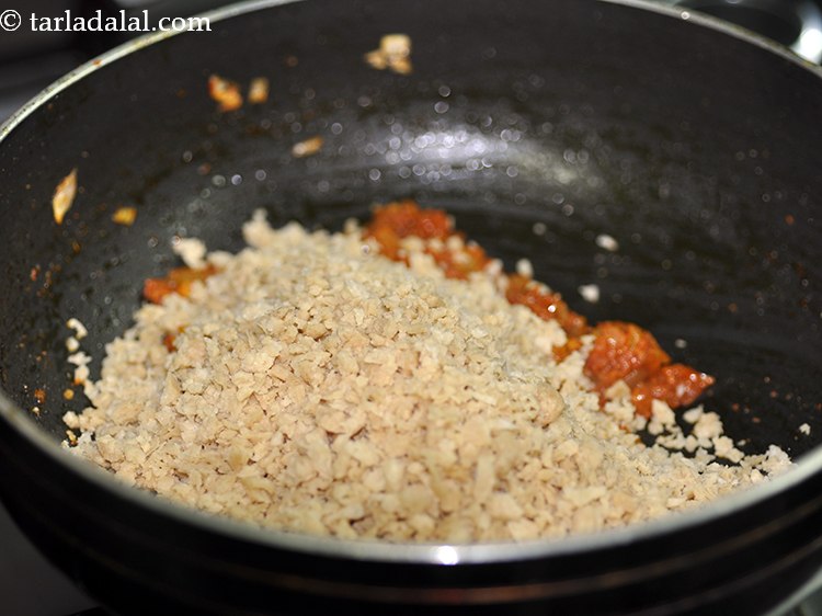 Step 22 – Add soaked soy granules.