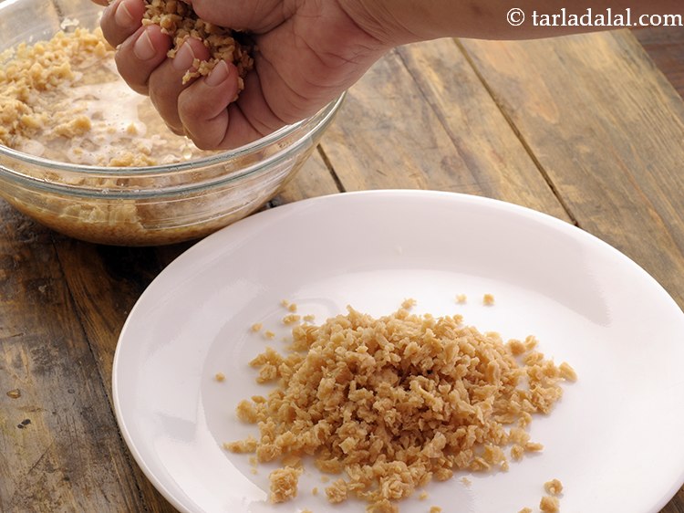 Step 5 – Open the lid and squeeze the soy granules to remove the excess water and discard …