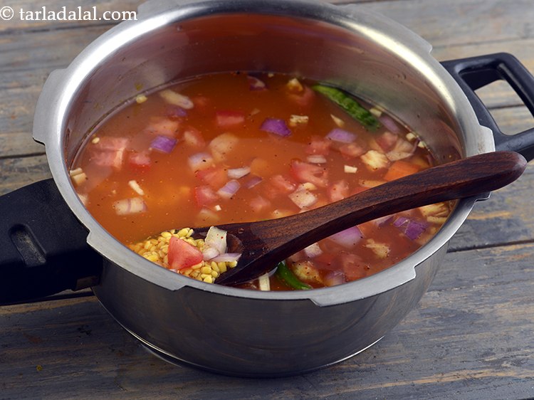 Step 35 – Add 1&frac12; cups of water, mix well and pressure cook for 2 whistles.&nbsp;