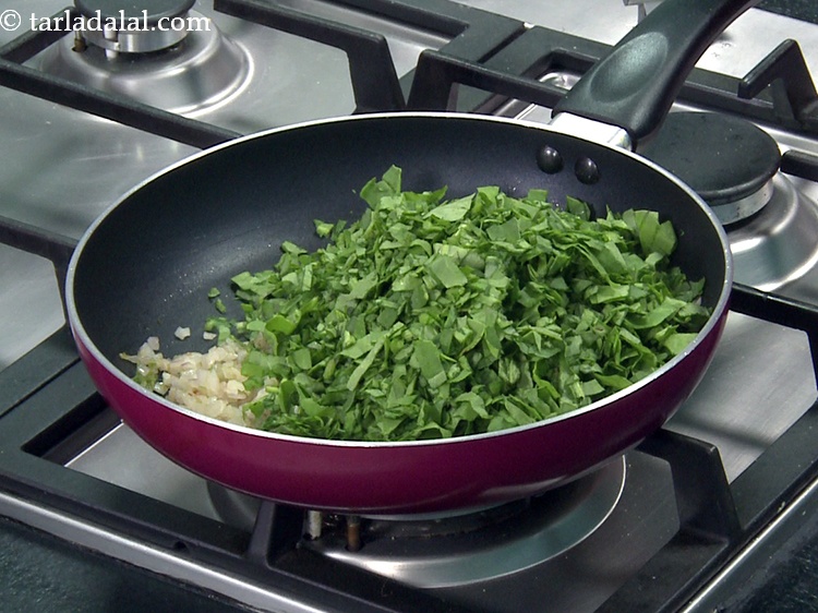 Step 22 – Add 2 cups&nbsp;finely&nbsp;<a href="https://www.tarladalal.com/glossary-chopped-spinach-780i">chopped spinach (palak)</a>.