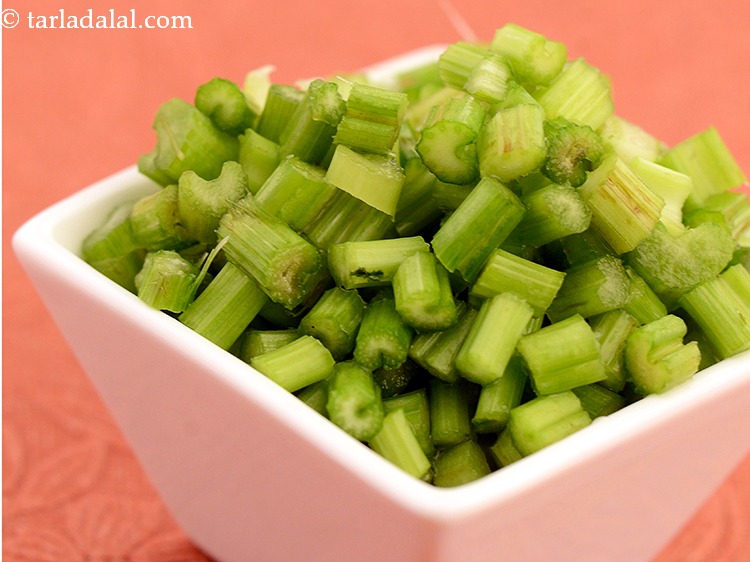 Step 16 – Next for <strong>healthy green juice</strong>, add some chopped celery to the jar.