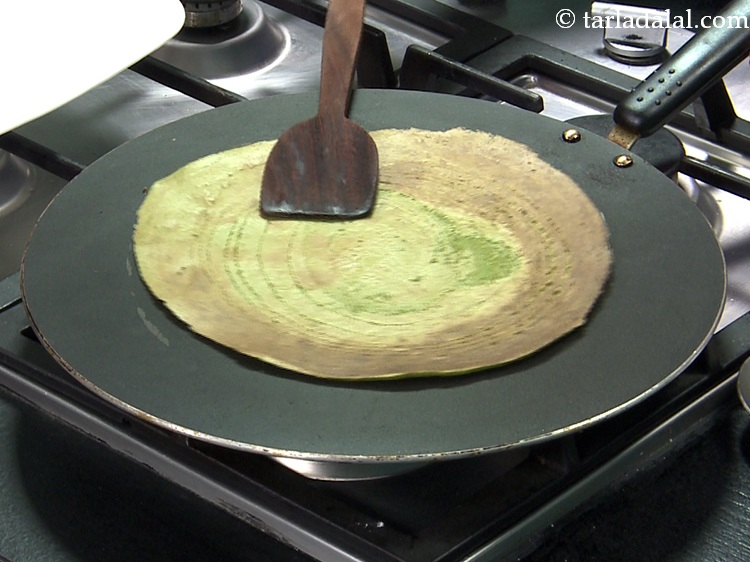 Step 25 – Turnover and cook till the dosa turns light brown in colour from the other side …