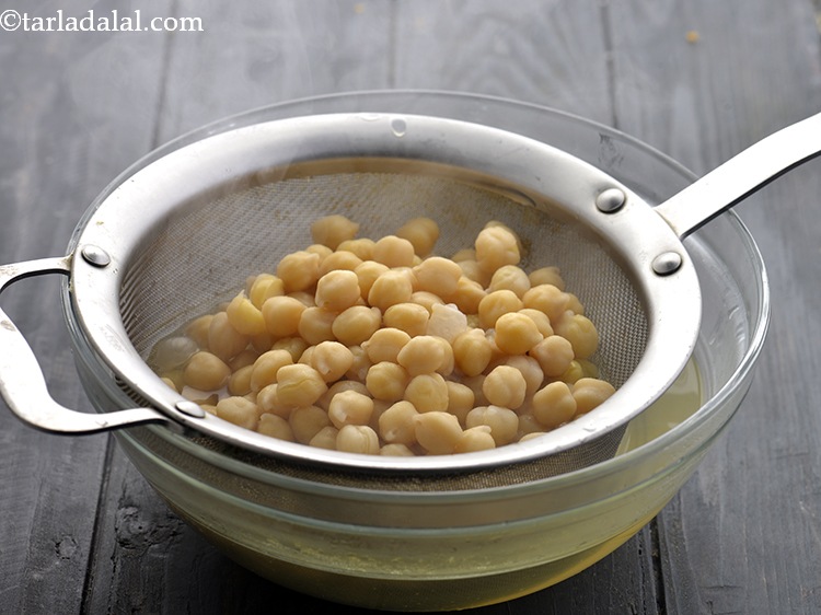 Step 8 – Drain the kabuli chana. Tip: Keep aside some cooking water of the chickpeas to add …