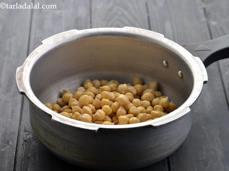 Step 5 – Put the soaked chickpeas in the pressure cooker.