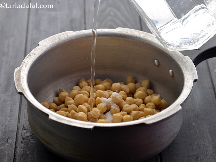 Step 6 – Add enough water and salt and pressure cook for 4 whistles. Here, overcooked chickpeas work …