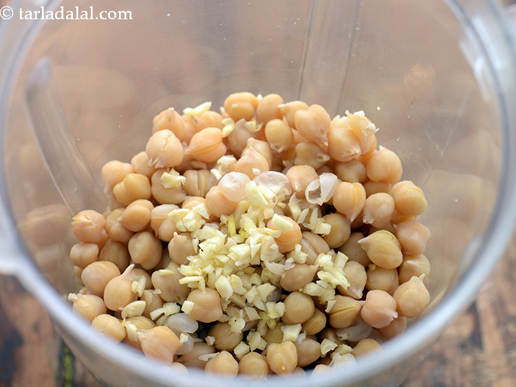 Step 11 – Add garlic cloves. If you are a jain skip garlic.&nbsp;