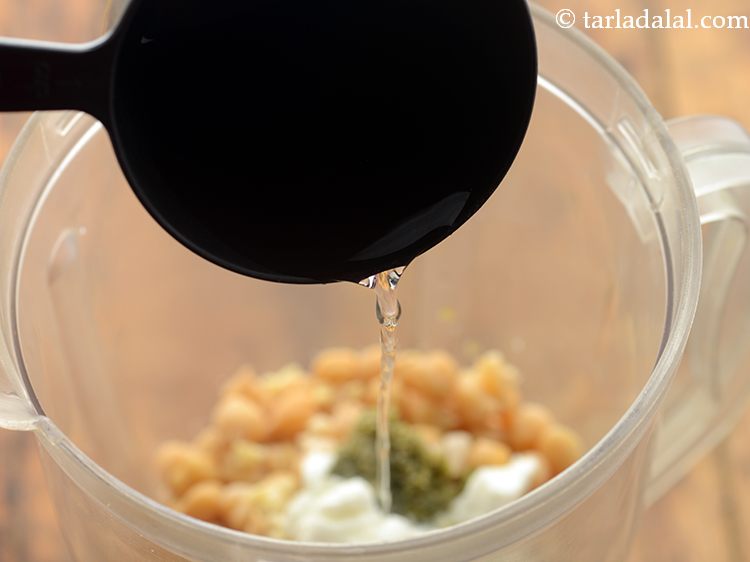 Step 16 – Add 5 tbsp of water. You may need little more if the hummus is very …