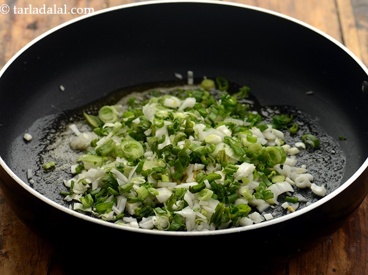 Step 10 – Add the spring onion whites.