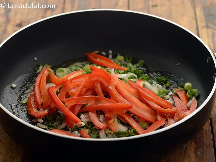 Step 11 – Add red capsicum. You can all the three colour capsicums if you wish to.&nbsp;