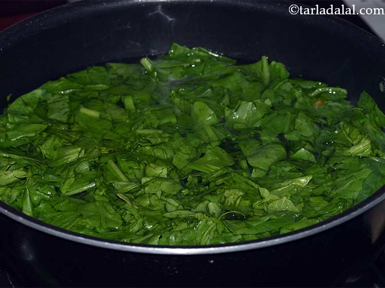 Step 11 – Now add the spinach leaves. Cook the spinach leaves in the water for 2-3 minutes …
