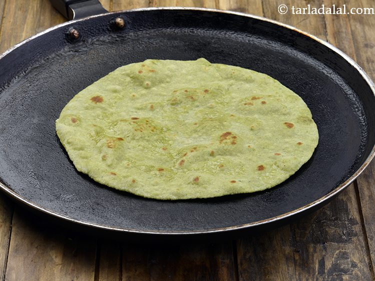 Step 9 – Cook each roti lightly on both sides on a tava (griddle) and keep aside.
