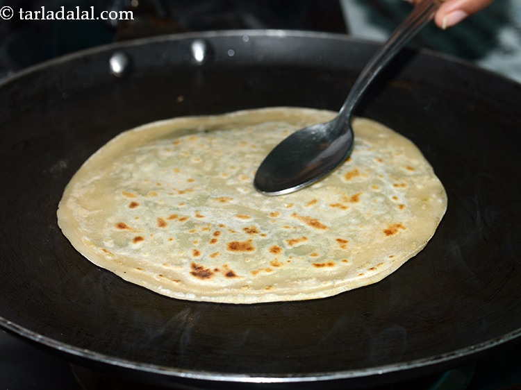 Step 21 – Turnover and cook both the sides till it turns golden brown in colour using 2 …