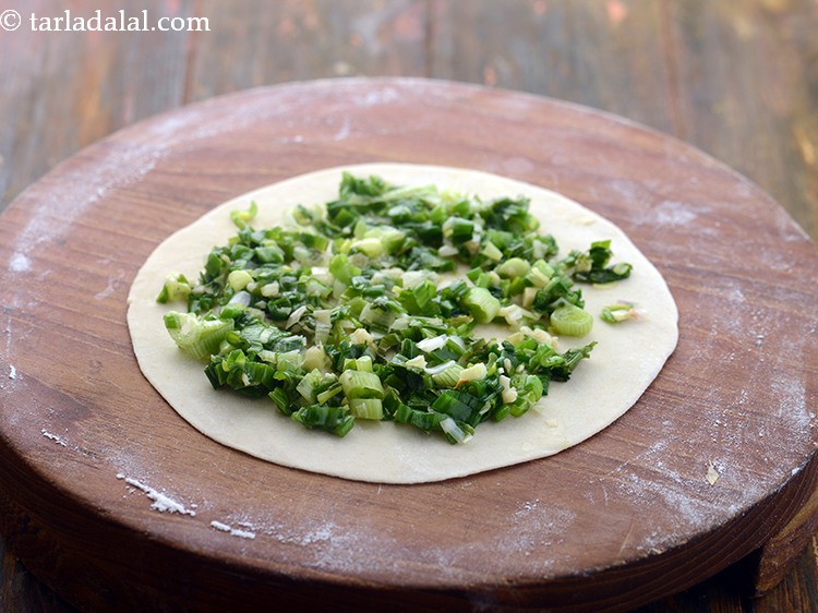 Step 16 – Spread a portion of the stuffing on one round and spread it evenly.