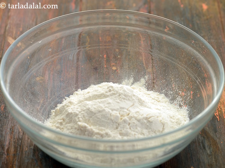 Step 2 – For the dough for <strong>spring onion paratha</strong>, take plain flour which is also known as …