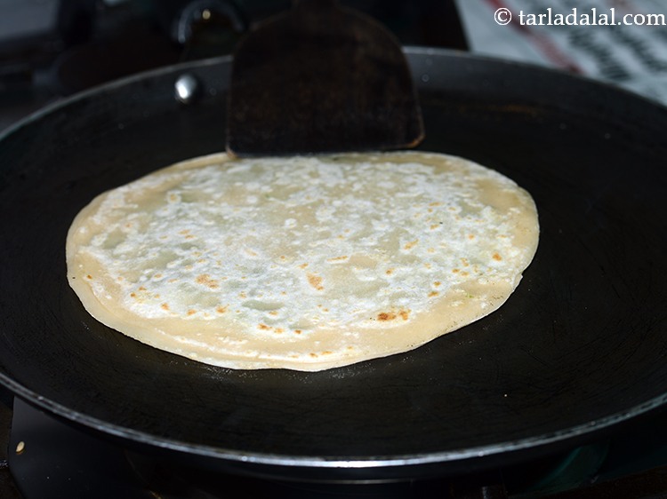 Step 20 – Cook on one side till blisters appear.