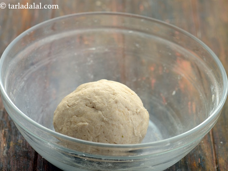 Step 6 – Mix it well and using enough water knead into a soft dough. Keep aside.
