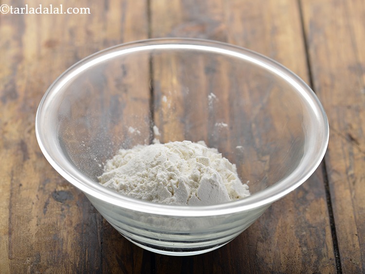 Step 16 – To make a sealing paste for the <strong>Spring Rolls</strong>, take maida in a small bowl.