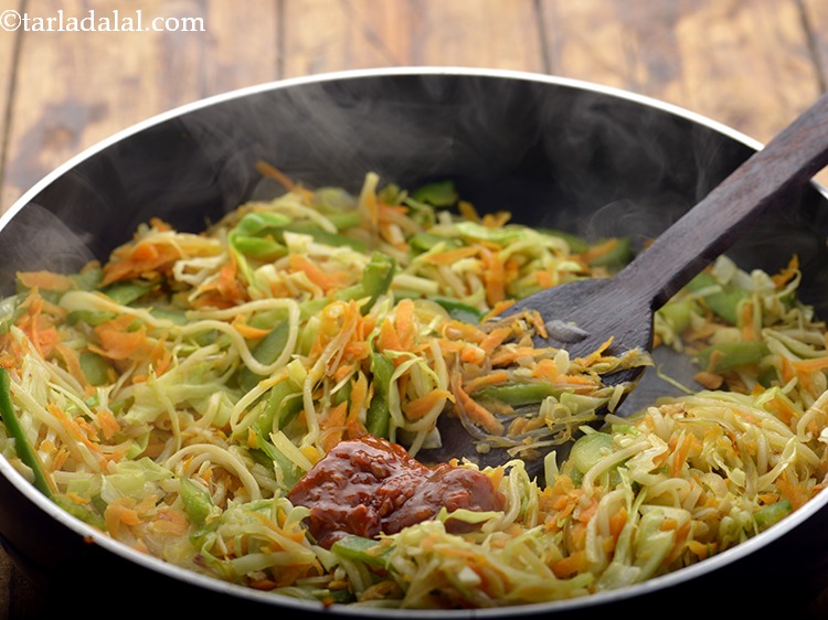 Step 12 – Switch off the flame, add the schezuan sauce. To make it more spicy, add red …