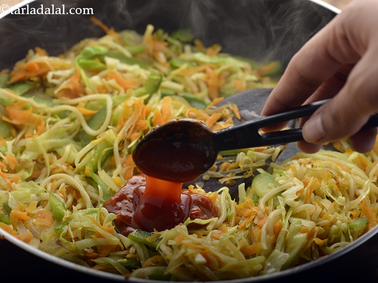 Step 13 – Add the tomato ketchup. It provides a nice tangy flavor to the fried spring rolls. …