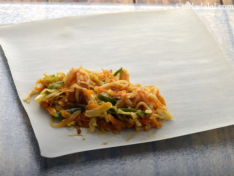 Step 19 – Place a portion of the filing mixture in one corner of the wrapper.