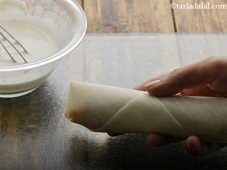 Step 23 – Seal the edge using a little maida-water mixture.