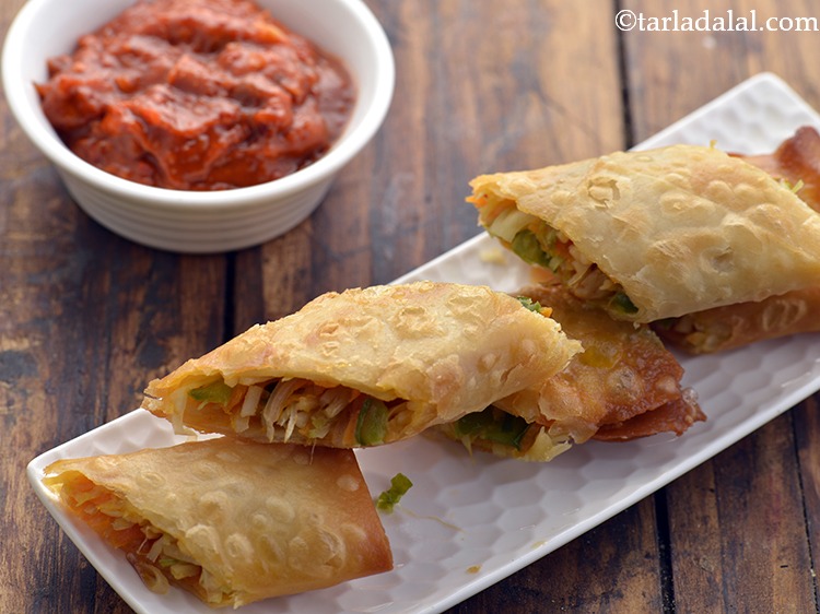 Step 30 – Serve the <strong>Spring roll</strong> immediately with schewan sauce.