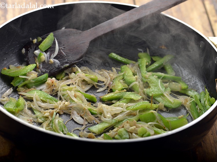 Step 7 – Add the capsicum and saut&eacute; on a high flame for 1 minute. To make the …